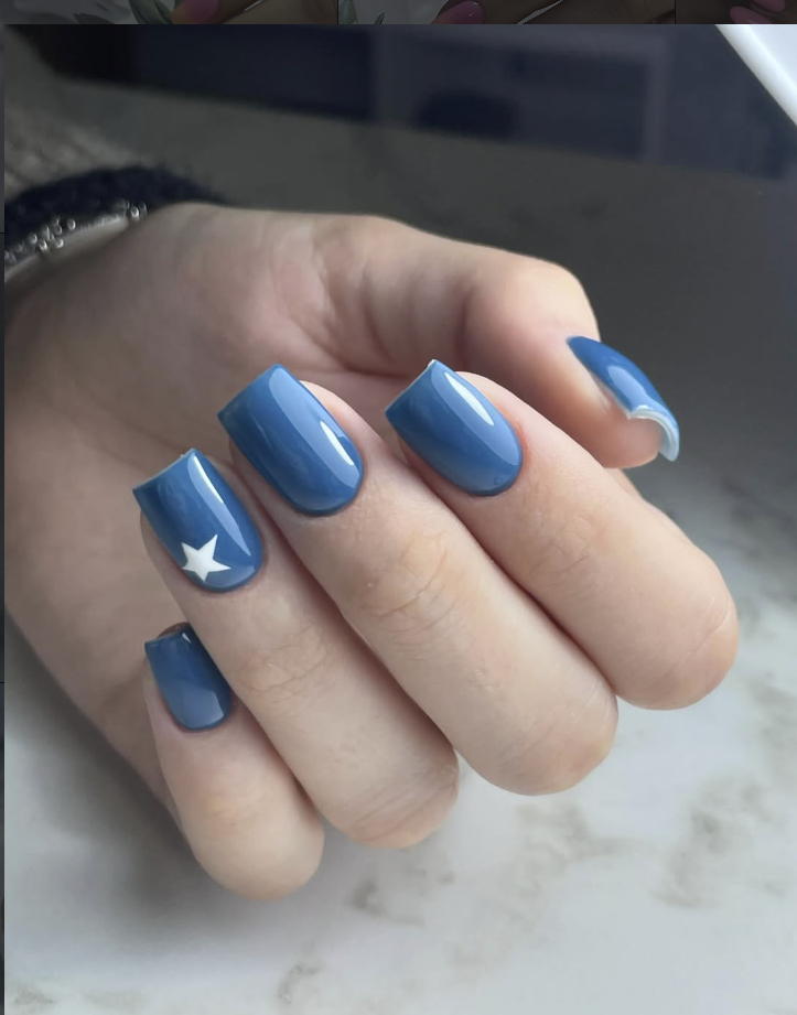 Dusty blue glossy manicure with white star accent