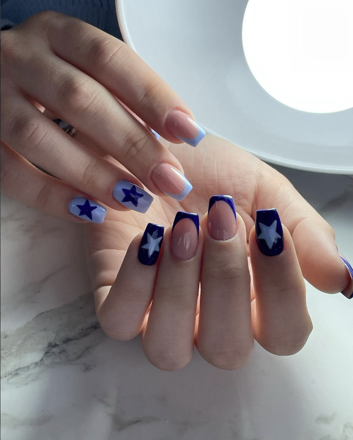 Navy blue French tips with star nail art