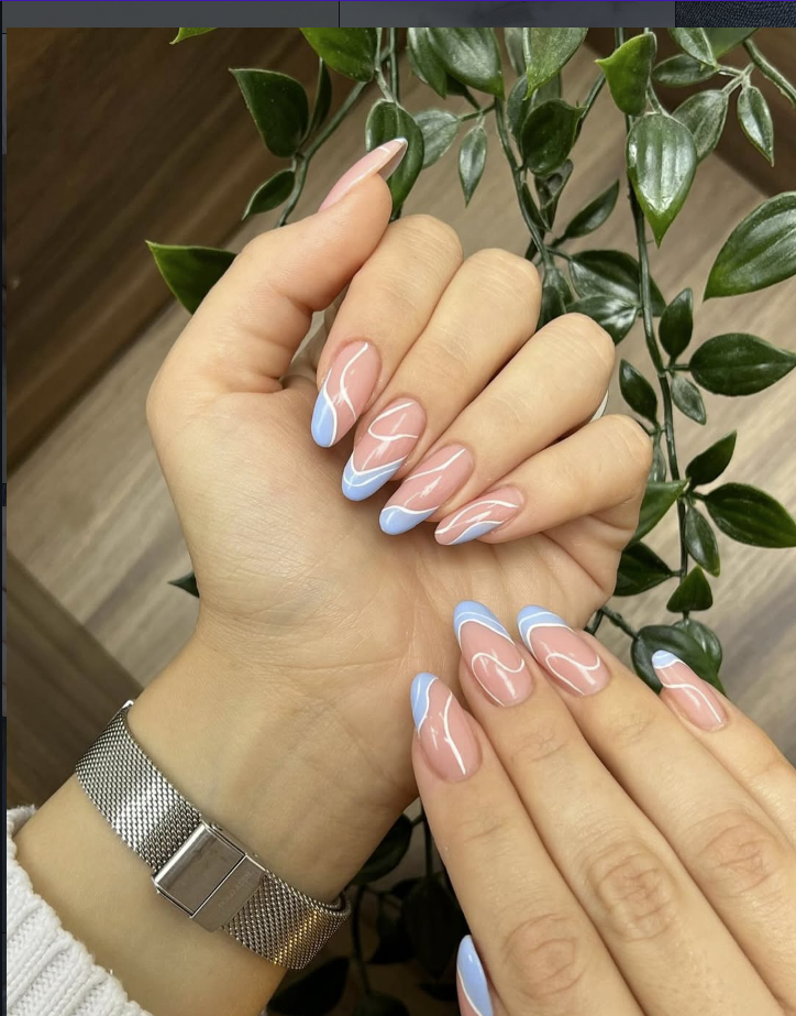 Soft blue swirl French manicure on almond nails