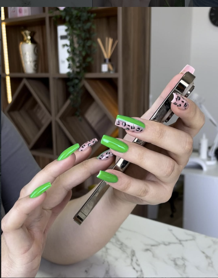Long neon green nails with leopard print accent