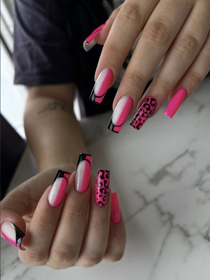 Hot pink coffin nails with black French tips and leopard accent